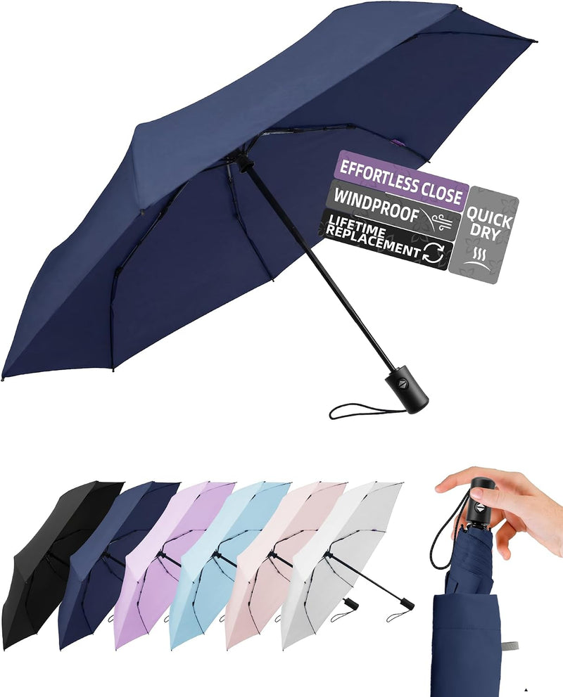 Navy folding travel umbrella shown open, with folded umbrellas in several colors below.