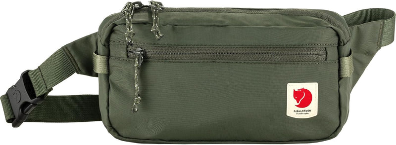 Green travel waist pack with a front zipper pocket and adjustable belt.
